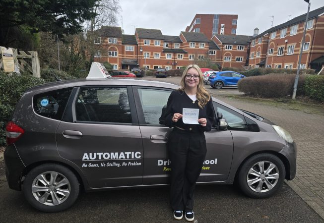 Happy student Jade celebrating passing her driving test with zero minors with EXL Drivers driving school in Rugby.