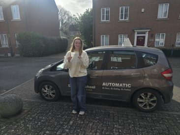 Jade smiling after passing her driving test with zero minors at EXL Drivers driving school in Rugby